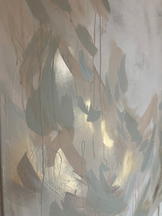 Close up of contemporary soft and elegant lustful abstract painting by uk artist Briony May Richardson at StudioBMR. Large brush strokes appear like feathers as they dance across the canvas in dusty pink and sage green tones. Background is washed in grey tones featuring specs of gold. Capturing paint drips and reflective metallic angles