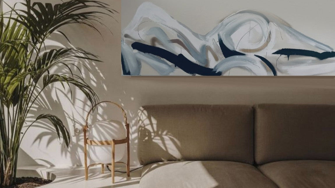 Contemporary canvas painting of a lying down lady in neutral colours. Painted with white, grey and black with gold and silver spray paint. Created by artist Briony May Richardson at StudioBMR