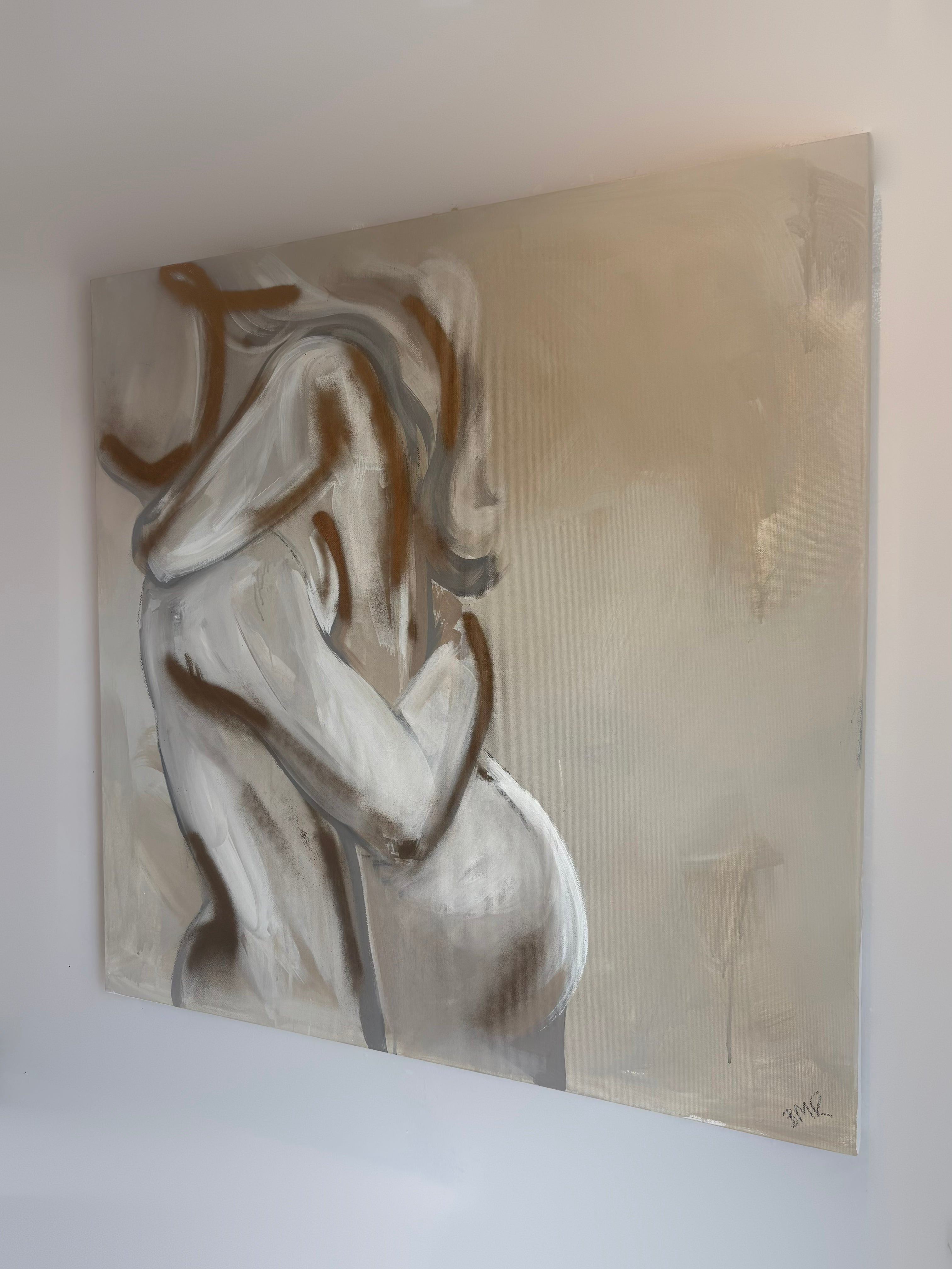 UK artist Briony May Richardson has hand painted this soft and romantic neutral beige, white and grey toned painting of a man and woman hugging. The painting features gold elements and is quite abstract in style.